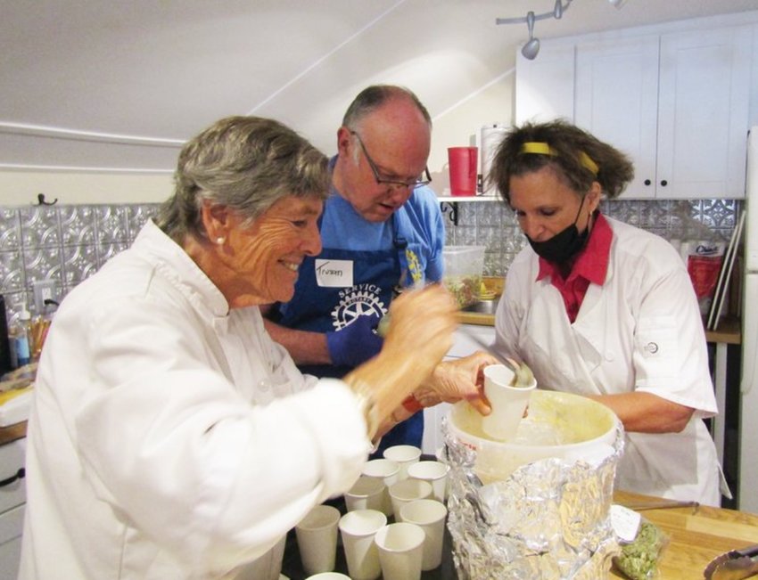 From left, chefs Kin Schilling, Trusan Comstock and Francesca Arniotes fill cups with butternut squash soup to start the Seniors4Success Thanksgiving lunch for seniors on Nov. 19, 2021. Deadline to reserve seats for this year’s lunch is Nov. 7.